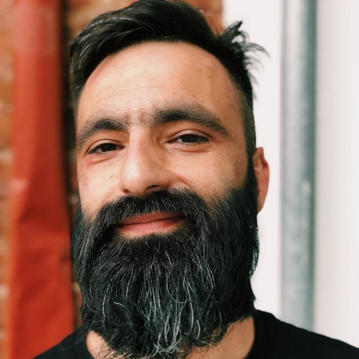 Kaveri Mehta, Lead Design Curator at TrailNookGarden, reviewing corporate floral arrangements